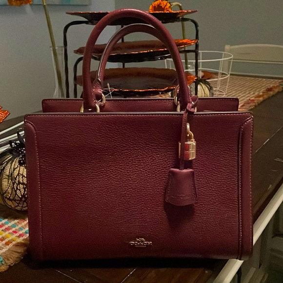 Coach Handbags - Coach medium hand bag.  About 7 inches wide.  More maroon than purple.